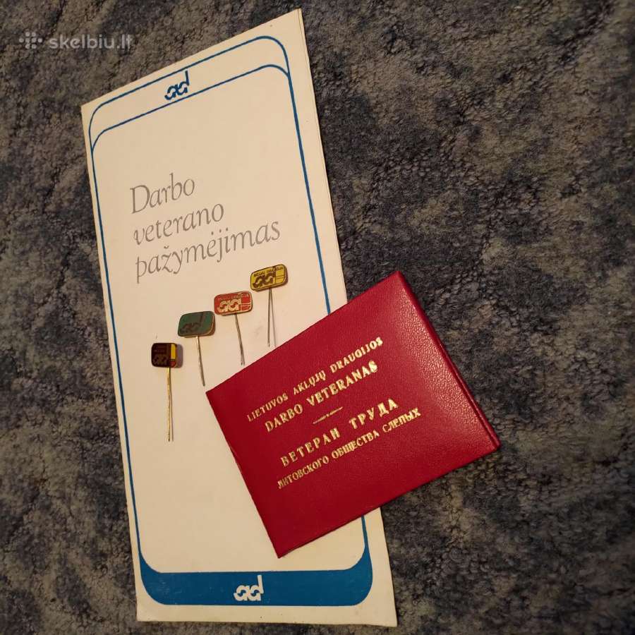 Aklūjų draugijos ženkliukai.