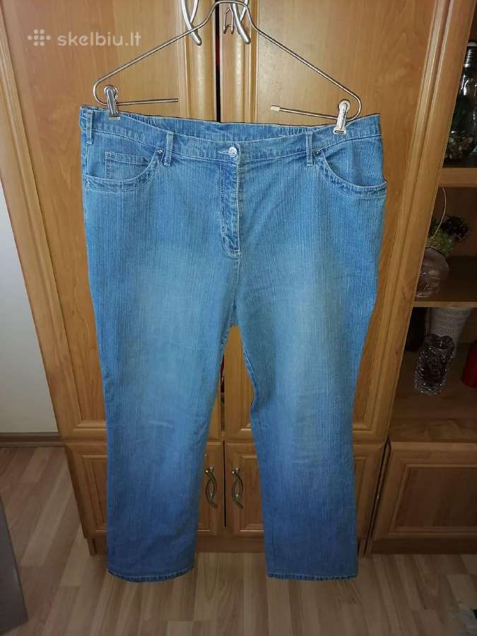 Šviesiai mėlyni moteriški didelio dydžio džinsai