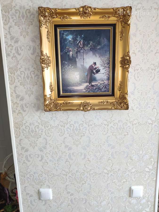 Paveikslas puošniu įrėminimu