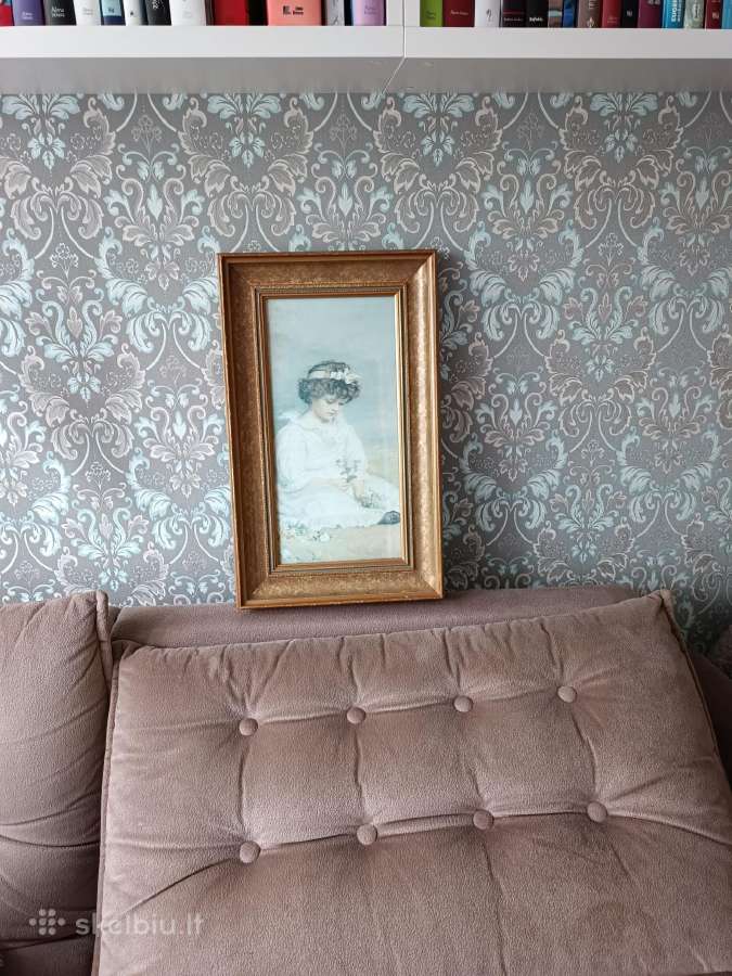 Romantinis paveikslas puosniu rėminimu