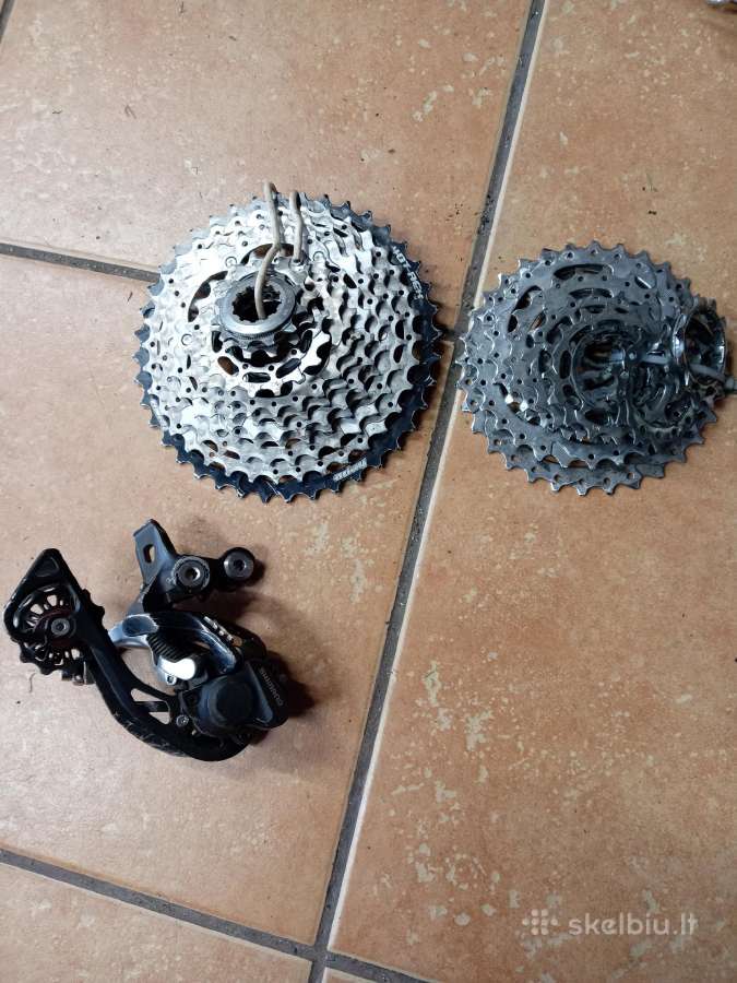 Shimano deore XT kasete ir galinis begiu permeteja