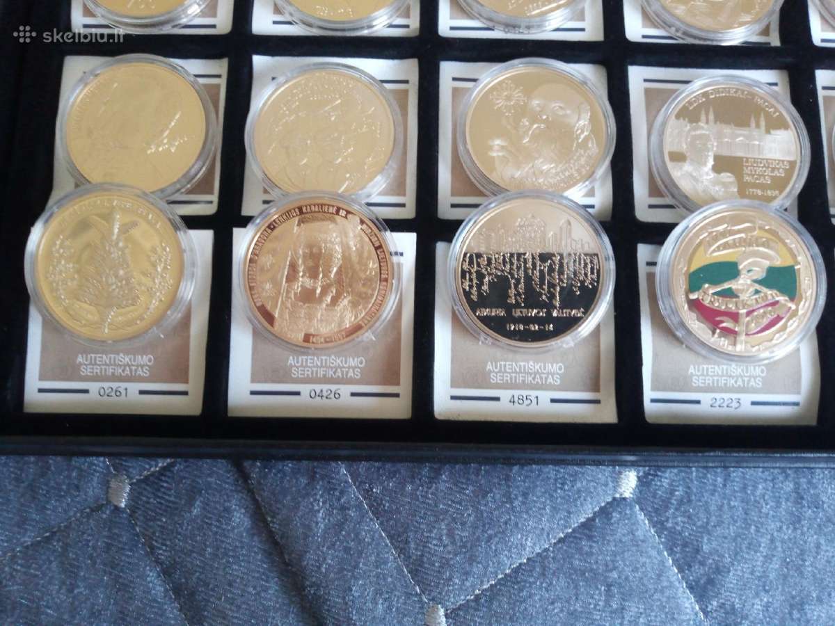 Paauksuoti proginiai medaliai