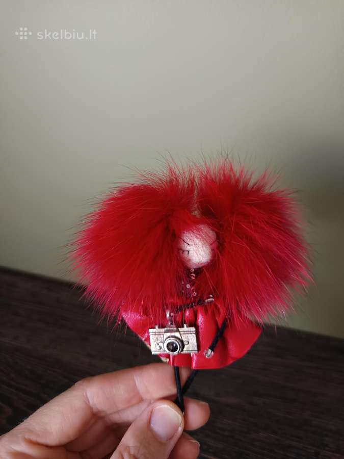 Sagė raudonplaukė fotografė