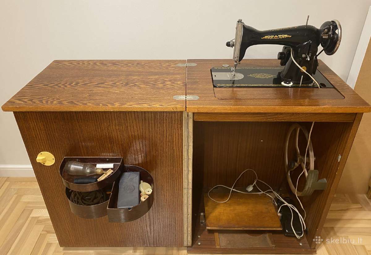 Siuvimo mašina su elektriniu varikliu ir spintele