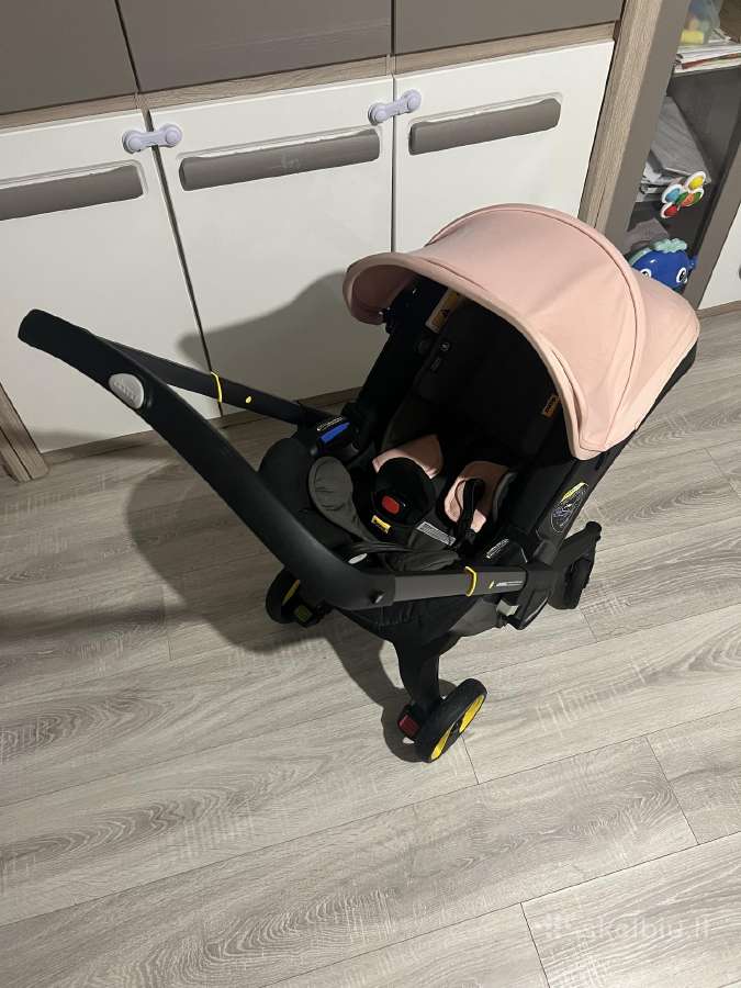 „doona“ 2in1 autokėdutė su integruotais ratukais