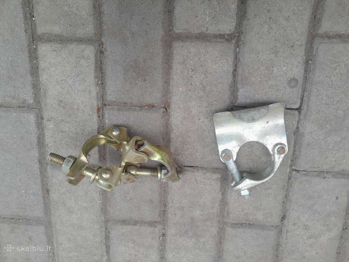 Stalažų dviguba spynos/vamzdžio laikiklis-lėkštutė