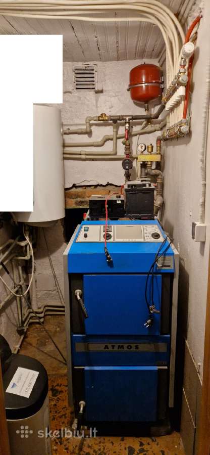 Atmos kieto kuro katilas su savo sistema