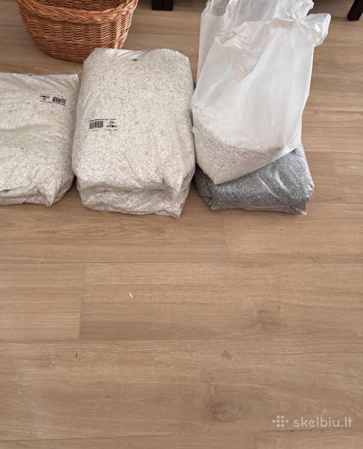 Akmens kilimo dangos medžiagų likutis.