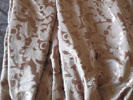 Naktines rudos uzuolaidos