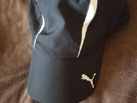 Puma kepure su snapeliu.