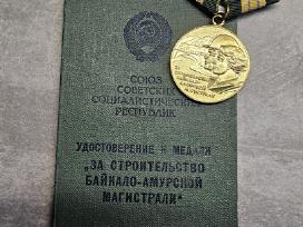 Medalis + knygutė.