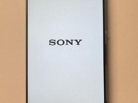 Mobilusis telefonas Sony Xperia F3111 su dėkliuku