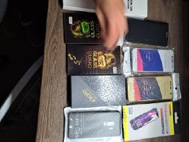 Telefonu dėkliukai krovikliai stikliukai