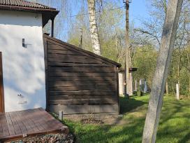 Galimas Keitimas. Sodyba ant upės šlaito