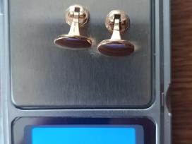 585 auksinės sąsagos.