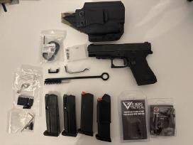 Glock 48 su daugybe priedų.