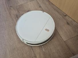 Dulkių siurblys-robotas.