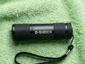 „g-shock“ Prožektorius - Žibintuvėlis