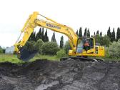 Komatsu stiklai: priekinis, durys, galinis ir kt.