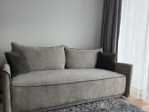 Pilka sofa -lova