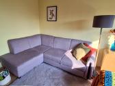 Sofa -kampas su miegama dalimi
