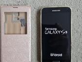 Telefonas Samsung Galaxy S5 su dėklu.