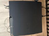 PS3 su žaidimais,vairu ir pulteliais