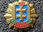 Krūtininis ženklas.