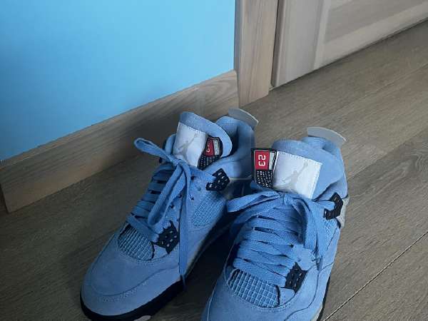 university blue jordan four
