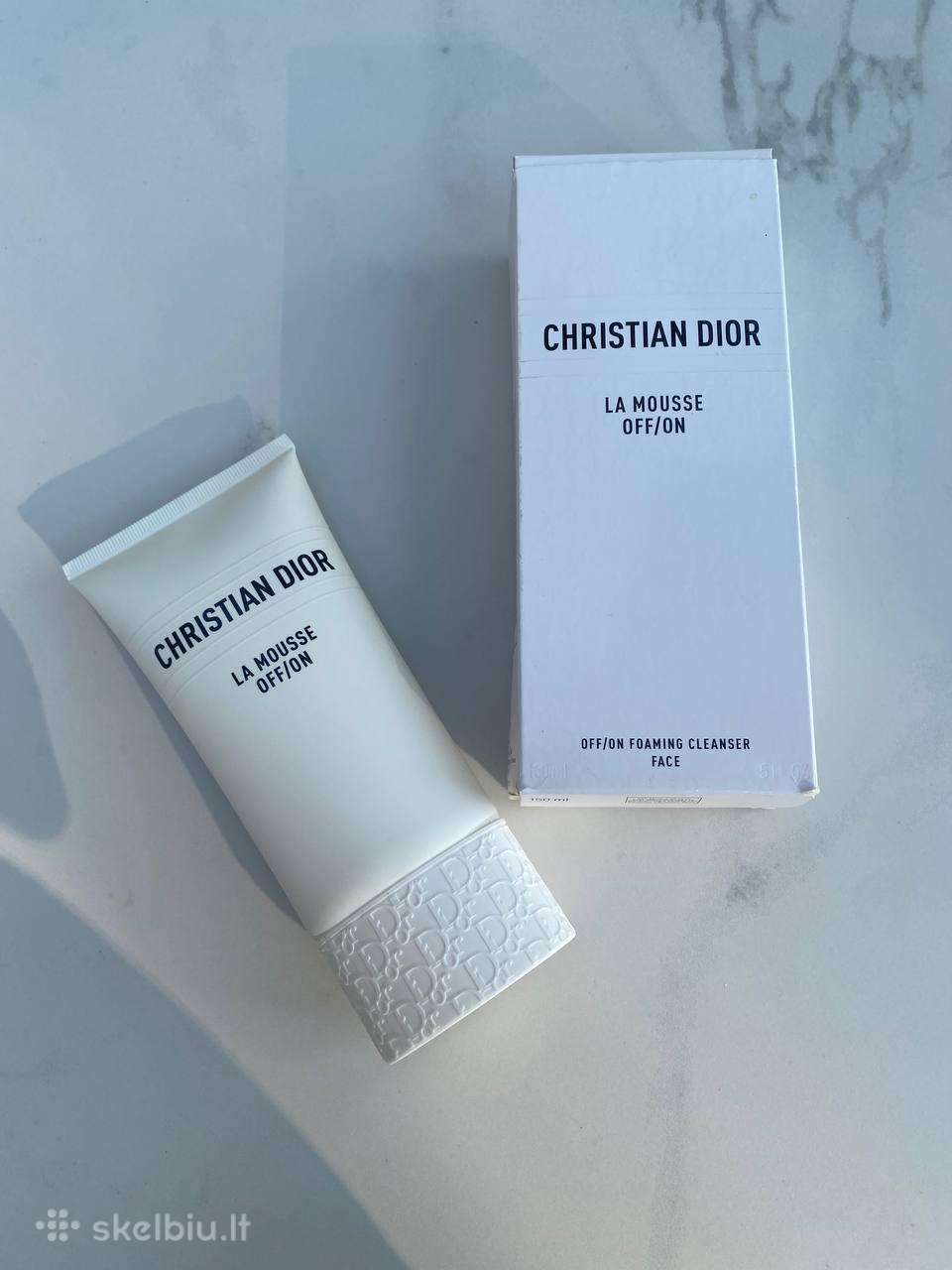 Christian Dior valomosios putos veidui