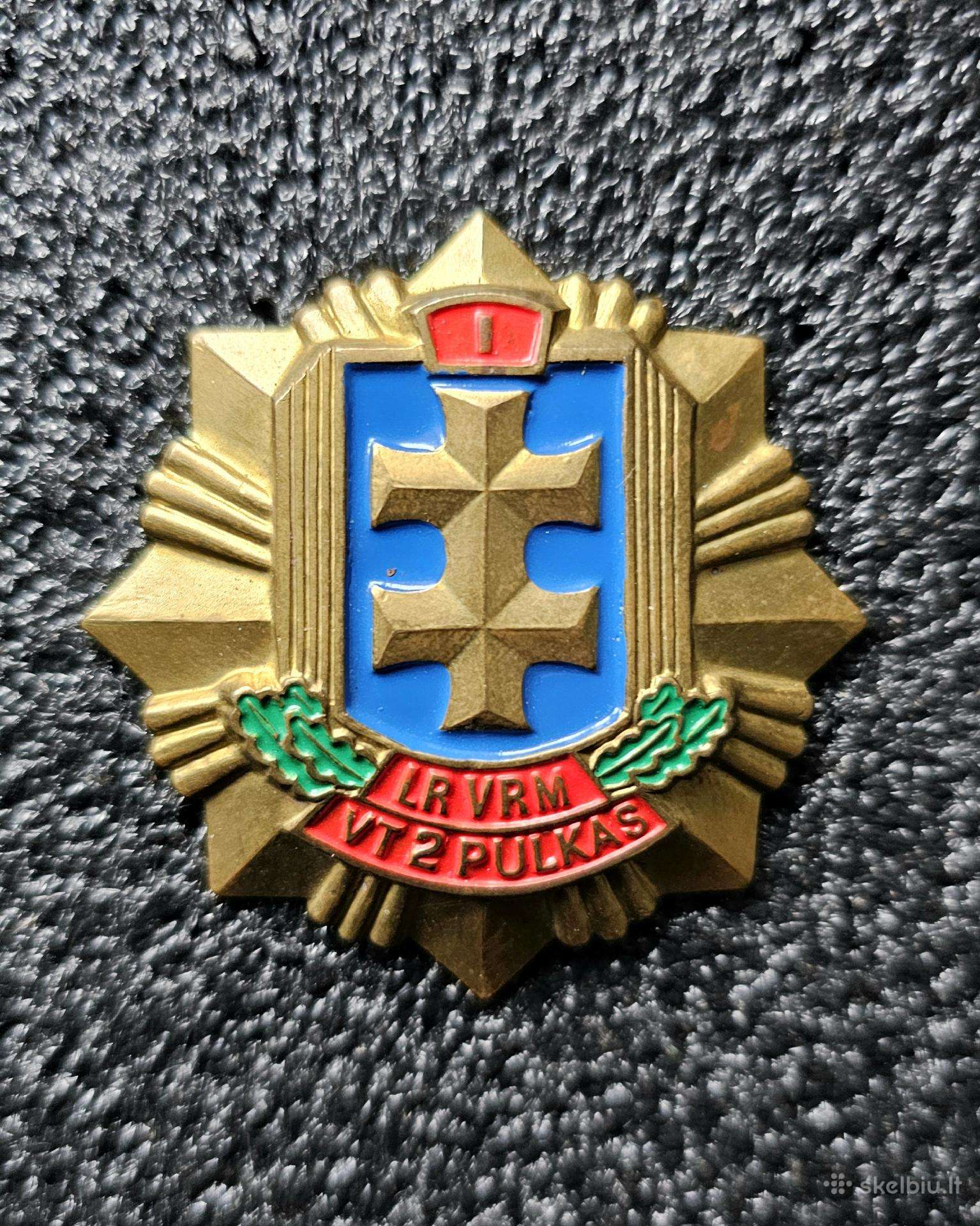 Krūtininis ženklas.