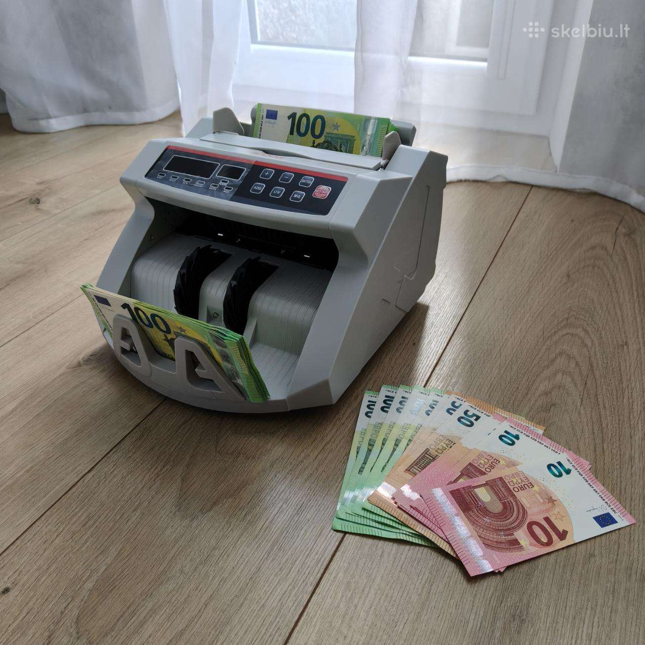 Pinigų tikrinimo ir skaičiavimo aparatas