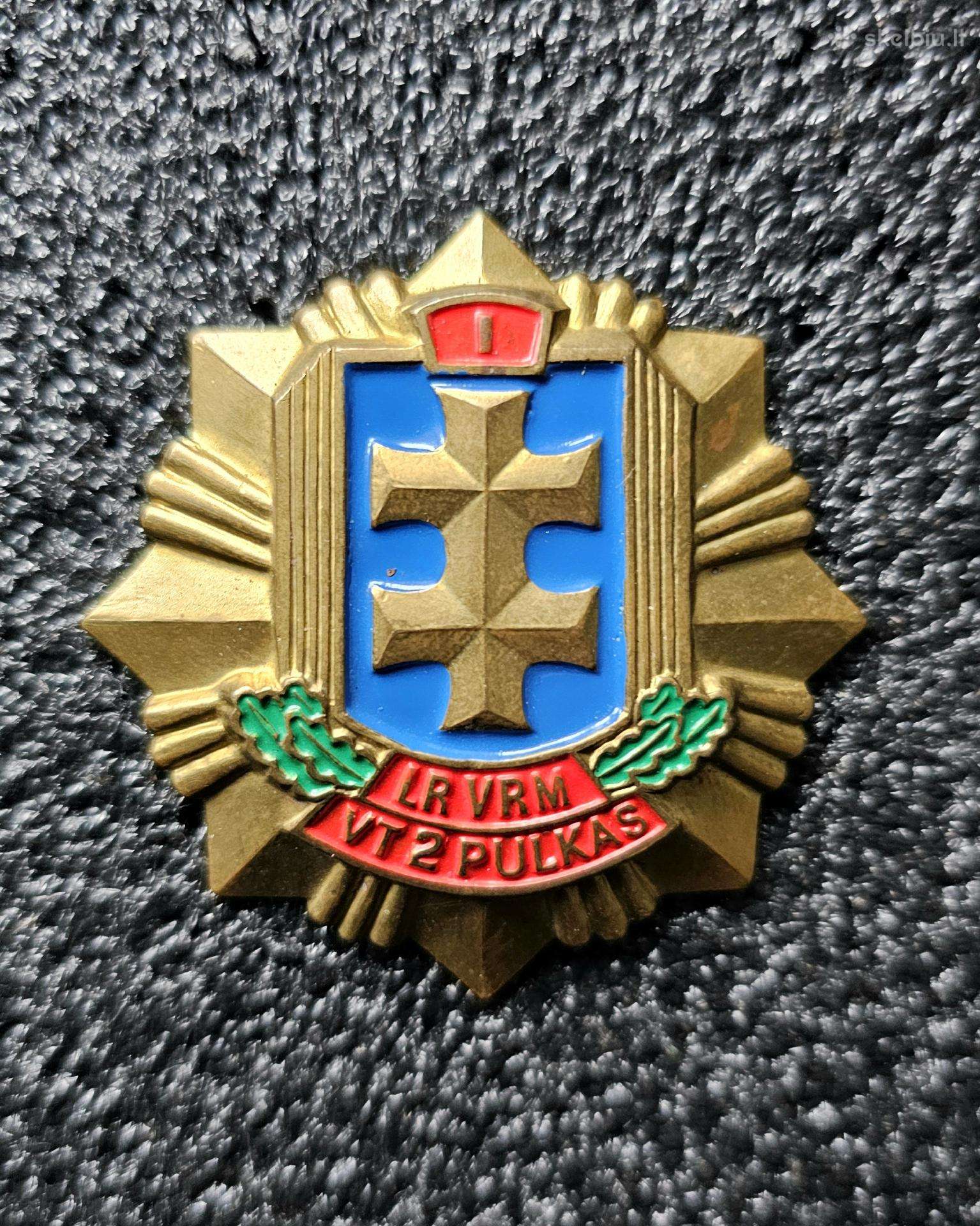 Krūtininis ženklas.