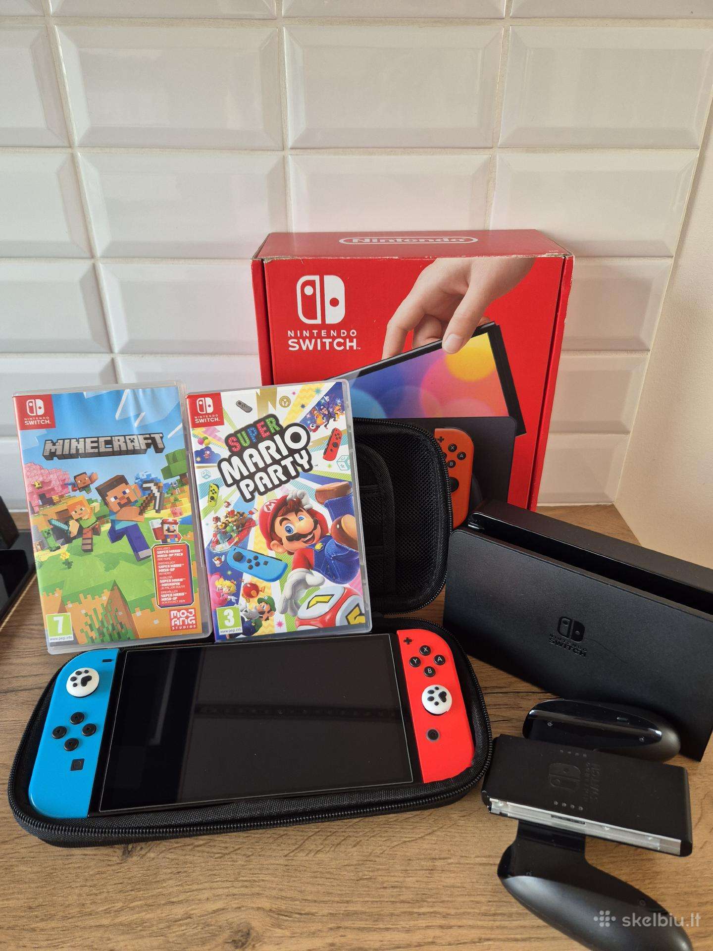 Nintendo Switch Oled 64 GB + 2 žaidimai + dėklas