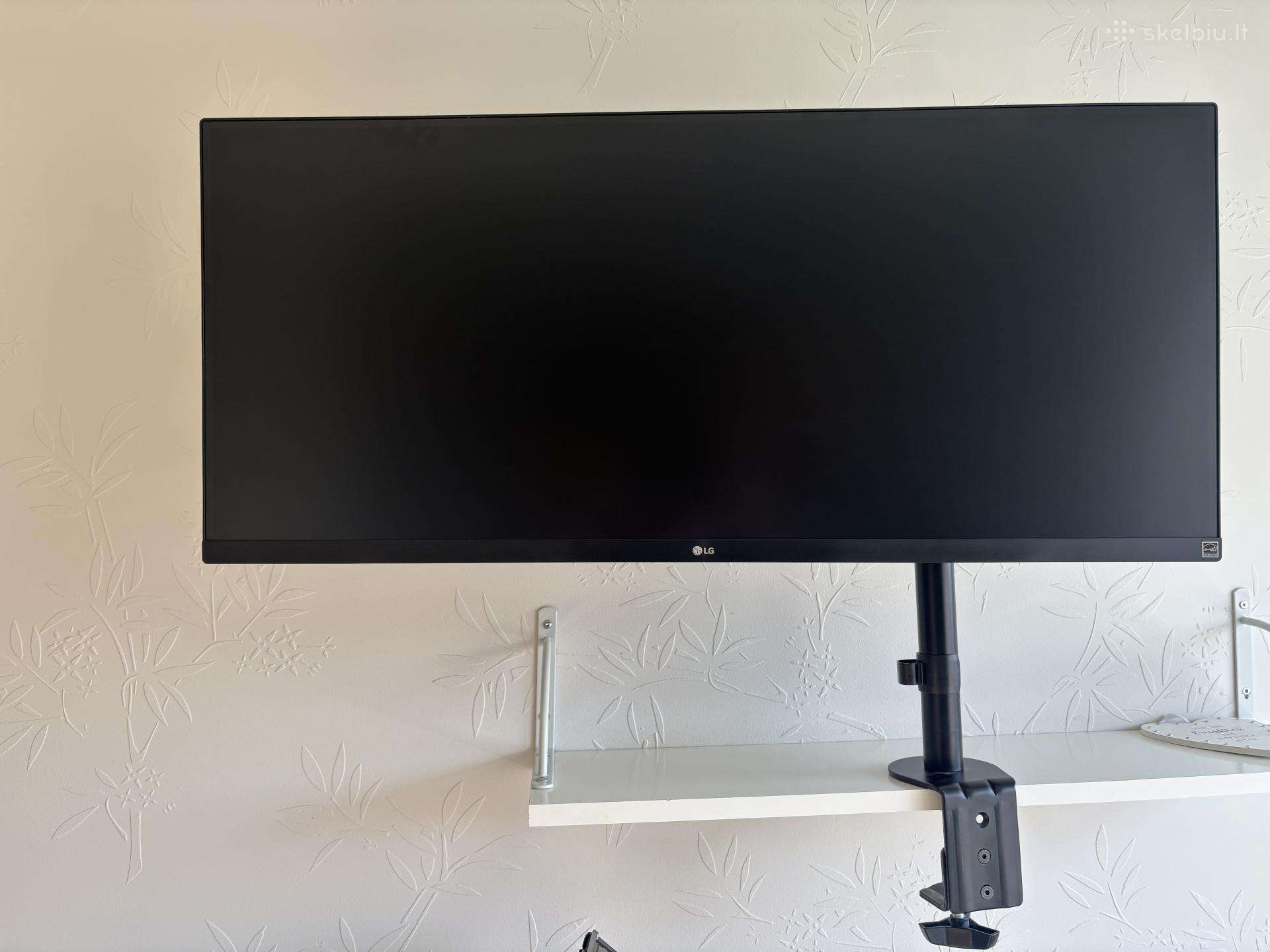 Ultrawide 34 LG monitoriu su stalo laikiliu