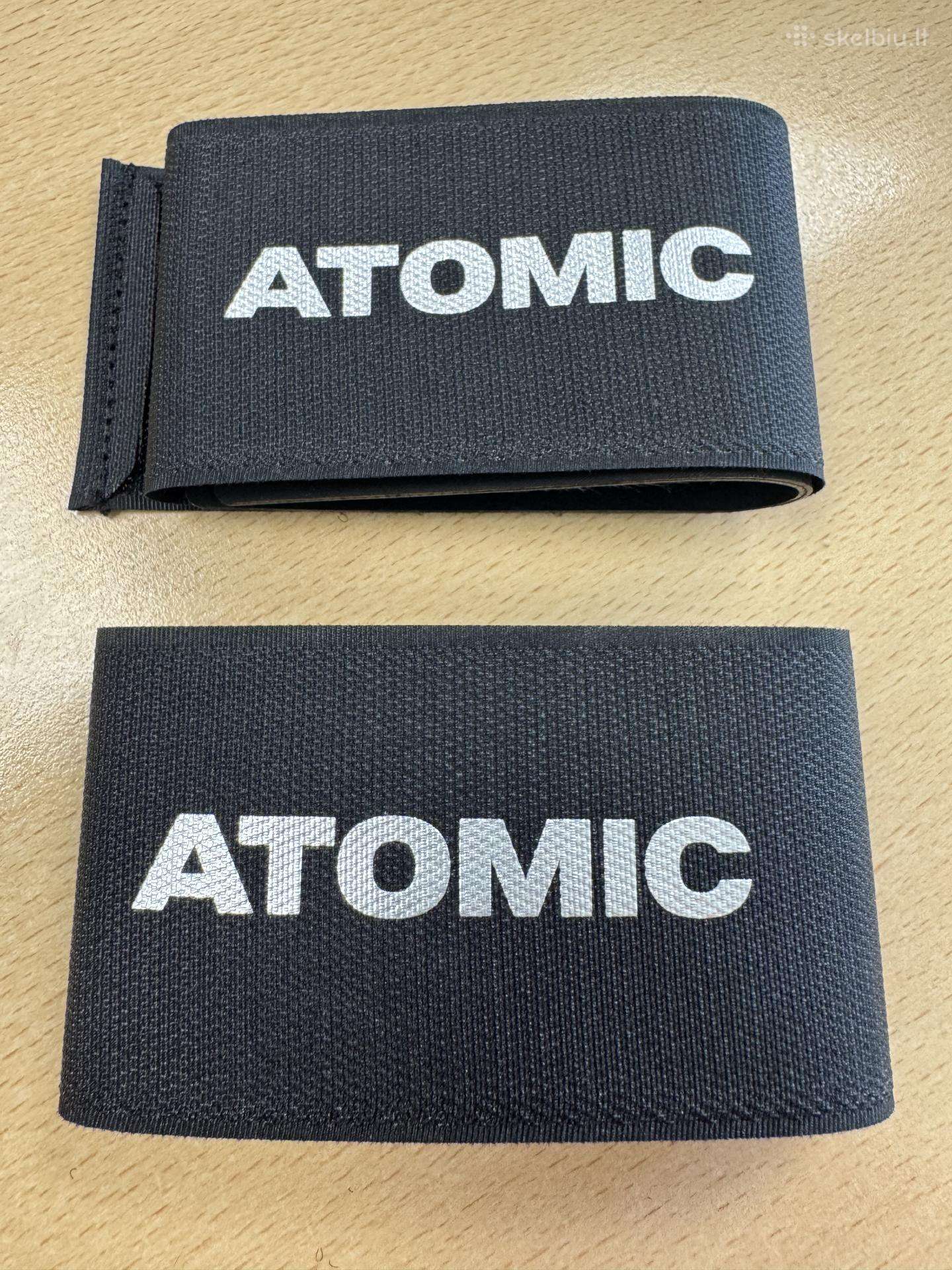 Atomic slidžių susegėjai
