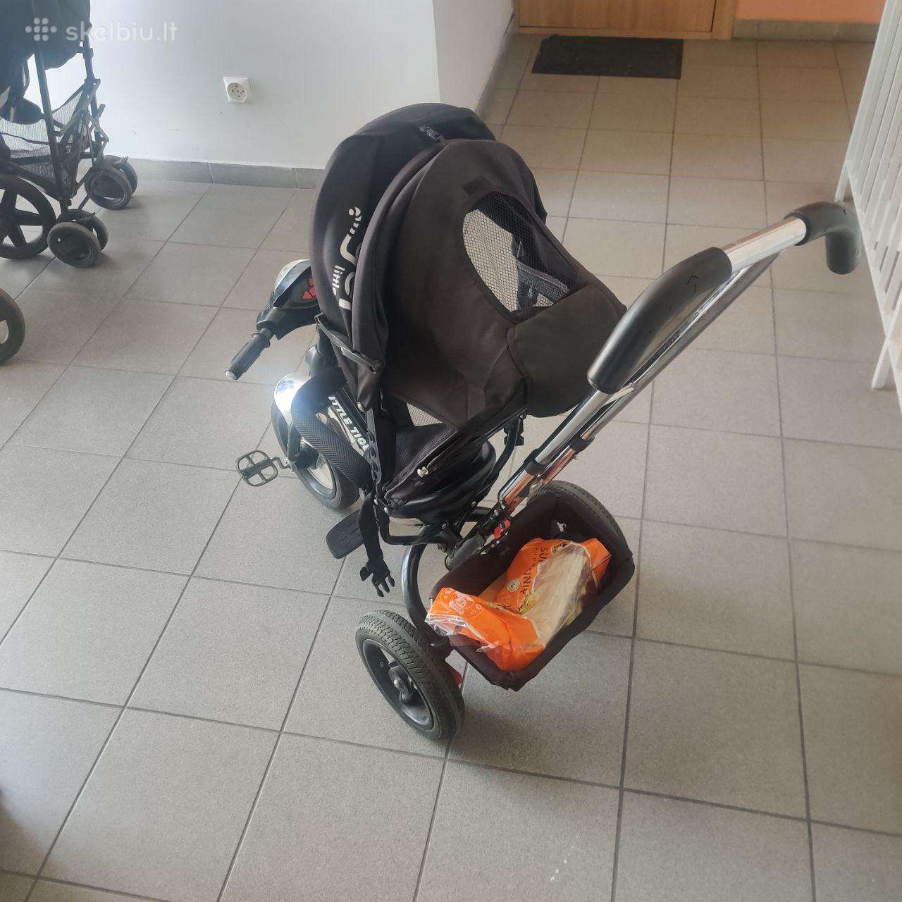 Triratukas su stūmimo rankena